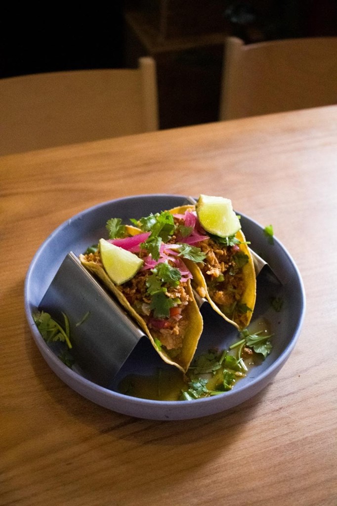 Pulled pork taco, guacamole, pico de gallo, pickled and fried onions - Image 1